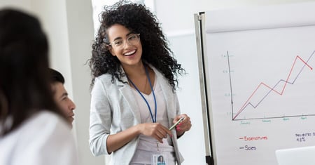 business woman showing data to colleagues