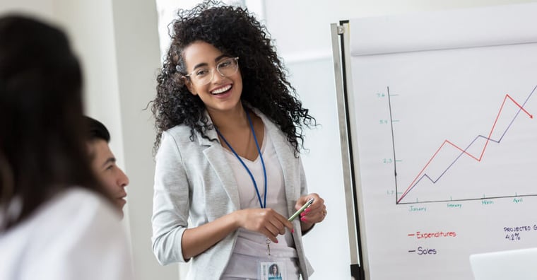 business woman showing data to colleagues