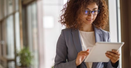 Healthcare leader reviewing information on tablet