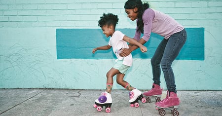 Mom and daughter roller skating