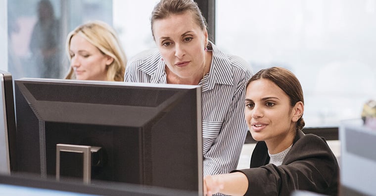 women looking at computer