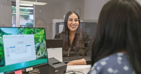 Patient at registration desk of doctor's office