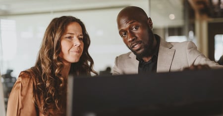 two people looking at a computer screen