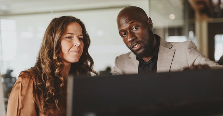 two people looking at a computer screen