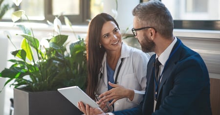 Two healthcare providers talking