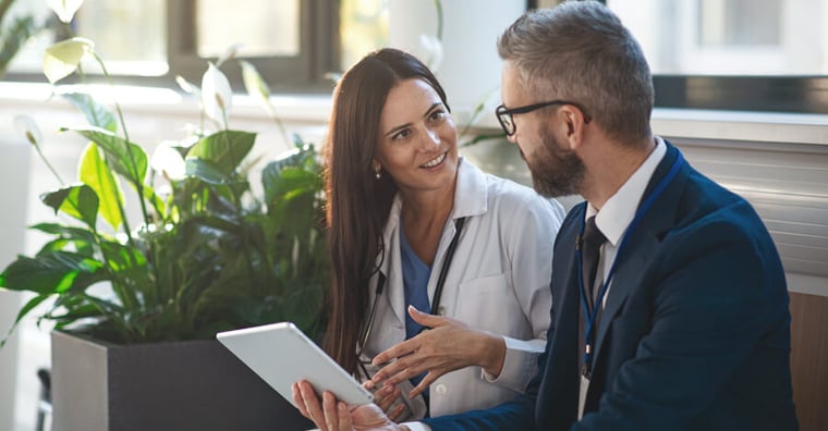 Two healthcare providers talking