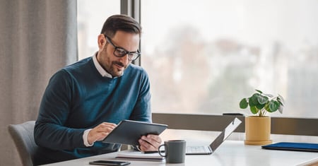 professional businessman looking at tablet