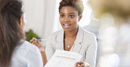Healthcare professionals talking about documents