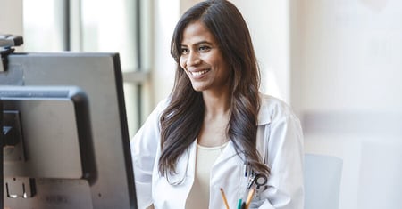 Doctor looking at computer