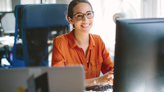 happy woman at computer