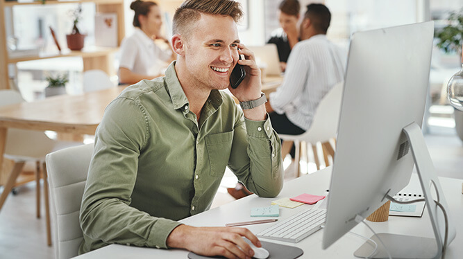 Smiling man at computer