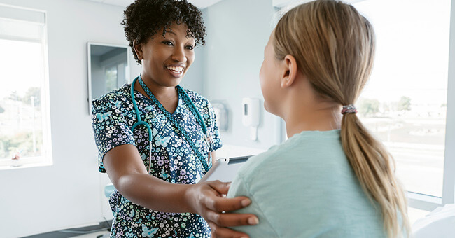 female doctor having conversation with female patient