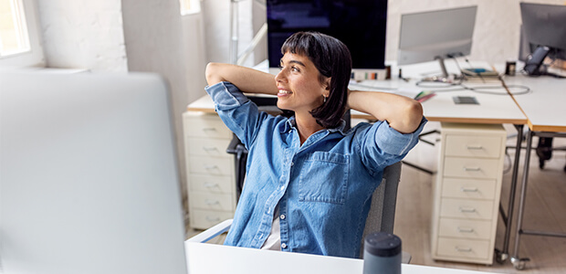 corporate healthcare professional with heads behind head while smiling